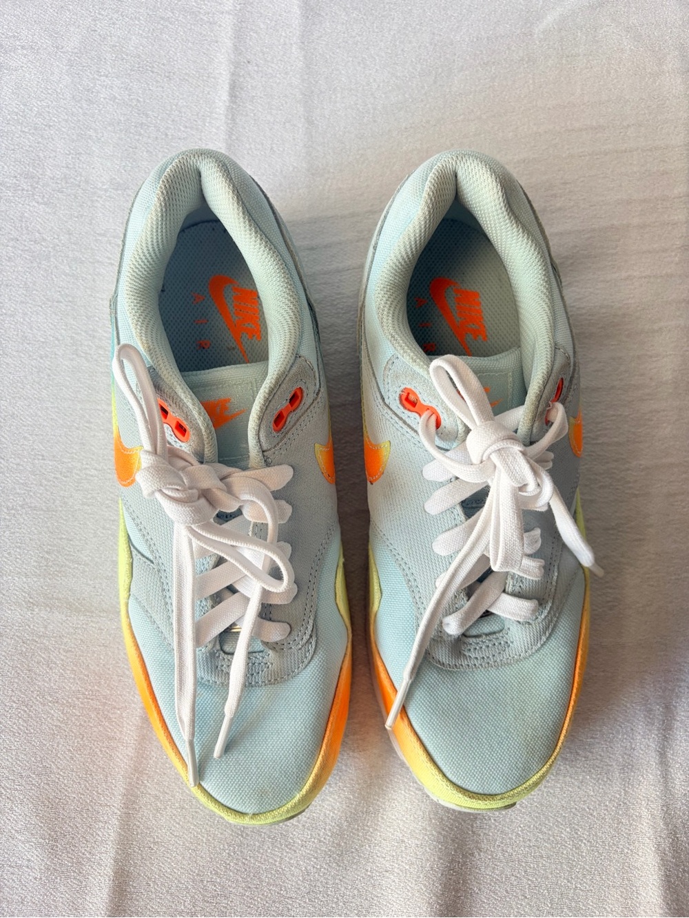 Nike Pale Blue Sneakers with Orange and Yellow Accents